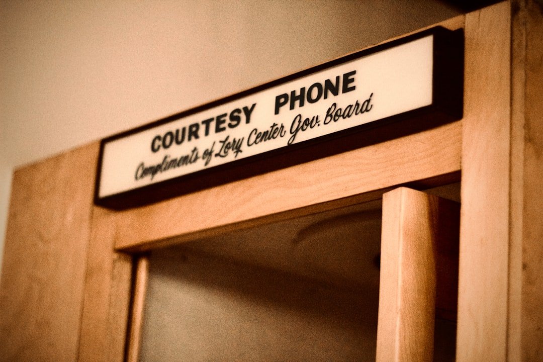 a-lit-sign-for-a-courtesy-phone-fnhqtkifxpq