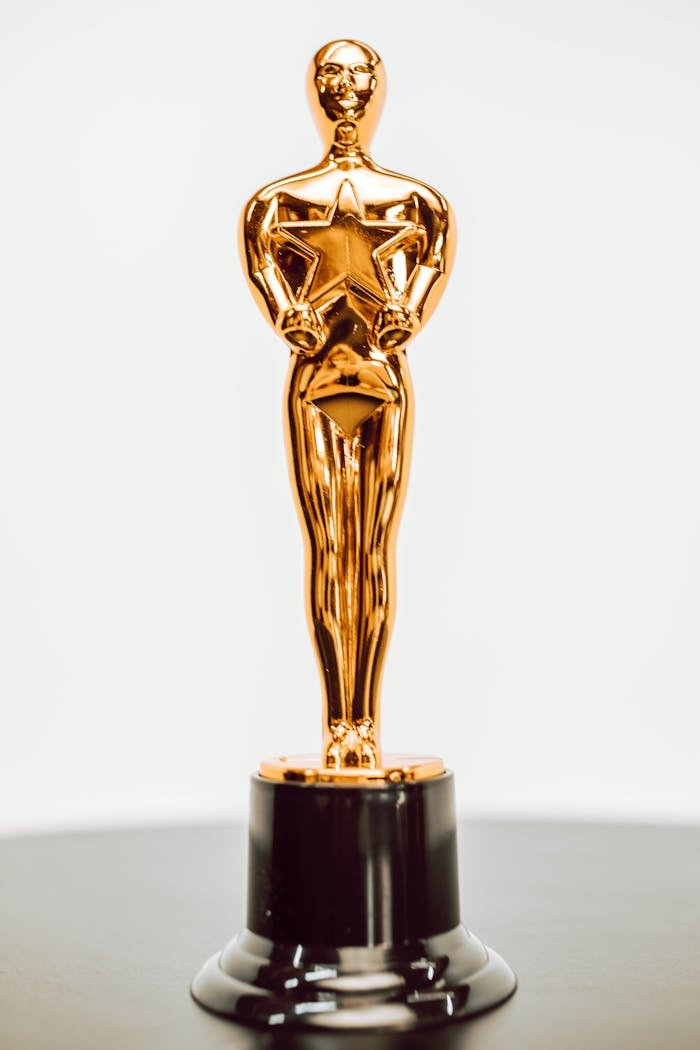 Close-up of a golden star trophy on a dark base, symbolizing achievement and excellence.